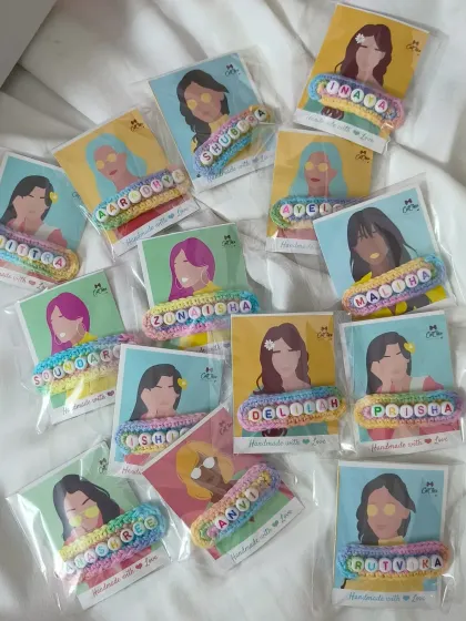 We love preparing bulk orders for birthday parties! Here's a large batch of our custom name hair clips, each individually packed and ready to be handed out as return favors.
