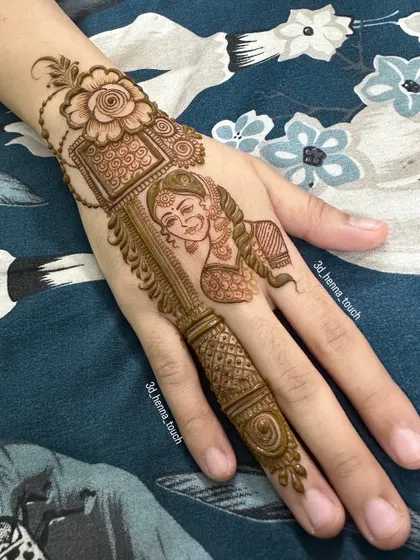 A creative design featuring a portrait of a woman on a single finger. This is a very unique and modern take on traditional henna.