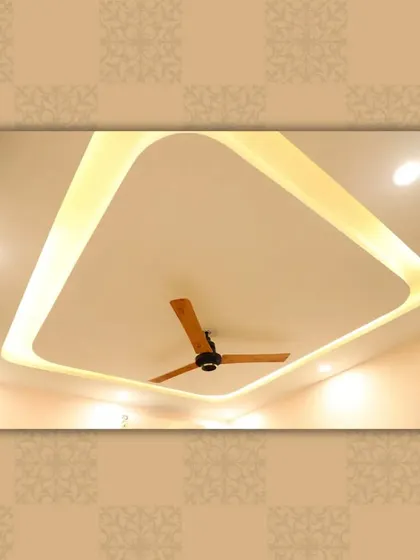 A modern tray ceiling with rounded corners and soft, warm backlighting, creating a cozy and inviting ambiance.