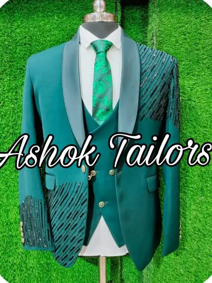 A dark green suit with abstract black sequin work, perfect for a cocktail night.