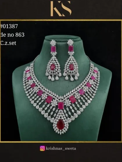 A premium C.Z. set with a classic design and ruby red stones. This is a timeless piece for any special occasion.