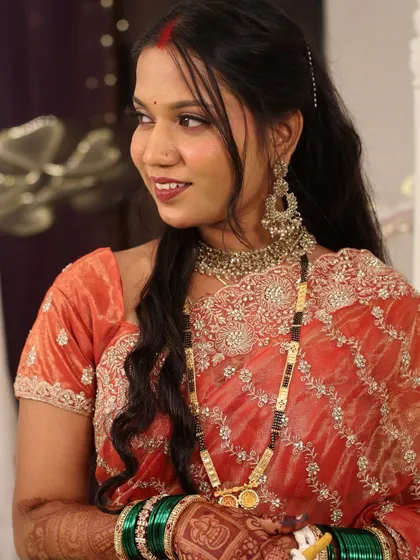 A candid shot of the bride. Her makeup is designed to be long-wearing, keeping her looking fresh throughout the reception party.