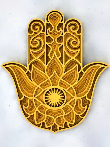 A full frontal view of the golden-toned Hamsa Hand mandala. This piece is perfect for an entryway or living room to welcome good fortune into your home.