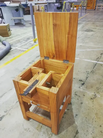 The open coconut grater box, revealing its clever internal design and solid wood construction, a perfect example of practical, user-centered design.