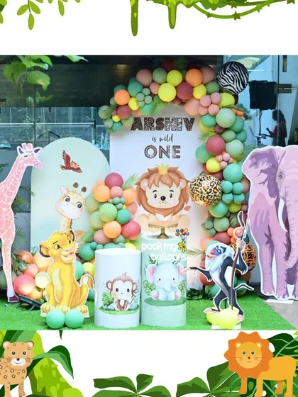 Arshev's "Wild One" birthday was a colorful take on the jungle safari theme. The decor featured a pink giraffe and purple elephant, mixed with pastel and leopard print balloons for a fun and vibrant celebration.