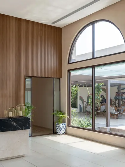 Another view of the light-filled reception, showing the clean lines and sophisticated material palette.