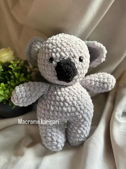Another look at our handmade koala plushie. It's the perfect size for little arms to carry and makes a wonderful, unique gift for any animal lover.