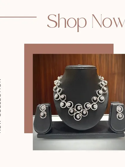 A modern necklace set with swirling circular motifs made of AD stones. This is a chic and stylish option for parties or contemporary outfits.