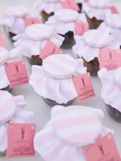 Our chocolate chunk and hazelnut cookie jars, beautifully wrapped for a celebration. A sweet and special party favour.