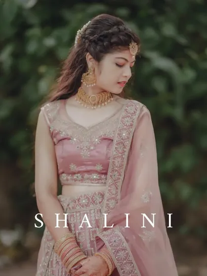 A beautiful portrait of the bride, Shalini, in a delicate pink lehenga, showcasing her soft and elegant look.