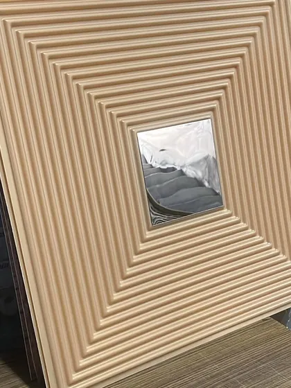This beige PVC panel features a grooved design with a silver mirror accent, offering a softer, more neutral color palette.