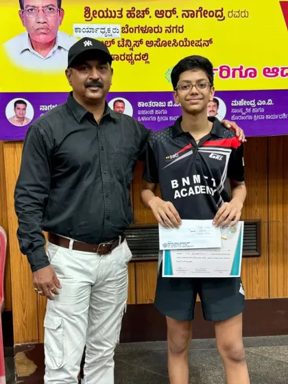 Coach Krunal Telang with Reyansh Jalan, who won the U-15 boys category. We encourage our players to strive for excellence in all aspects of their lives.