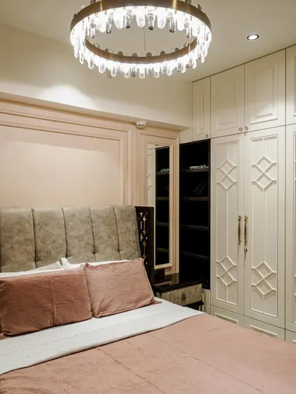 A different angle of the bedroom from image 46, showing the full wardrobe and dressing area.