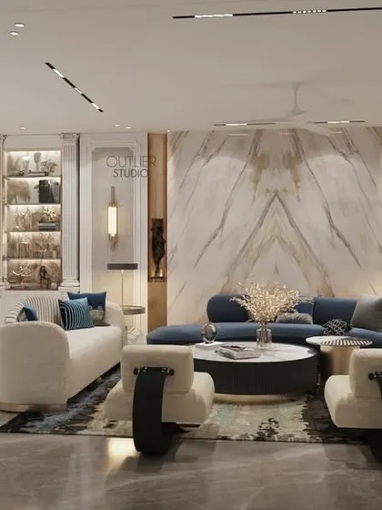 Where memories are made. This open-plan living and dining area features a stunning arched bar cabinet, a book-matched marble wall, and a mix of white and blue furniture for a fresh, contemporary look.