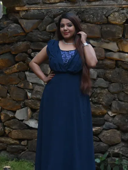 A full-length view of my navy blue evening gown. The flowing silhouette and sequined top add a touch of glamour, perfect for a special occasion.