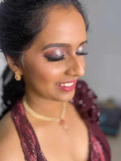 A beautiful bride with sparkling, glittery eyes and a soft pink lip. This is a perfect look for a glamorous evening reception or cocktail party.
