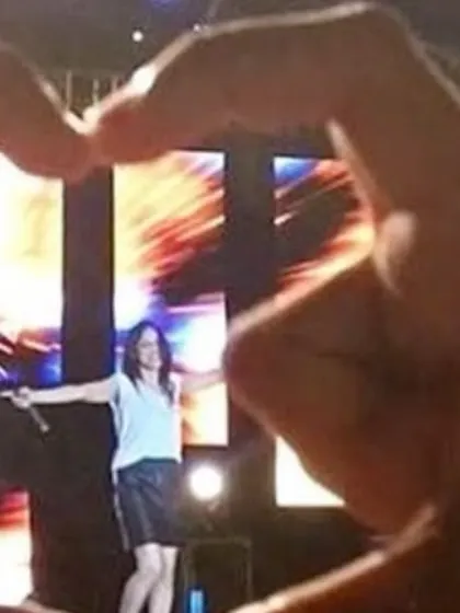 A fan's perspective, making a heart with their hands. Seeing this kind of love from the crowd is what makes it all worthwhile.