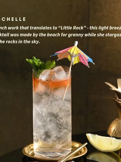 Rochelle means "Little Rock" in French. This light, breezy cocktail was made for stargazing on the beach, with a tiny umbrella for that holiday feel.