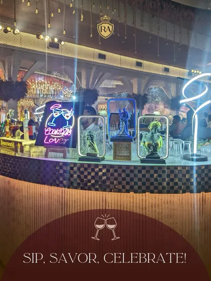 Sip, savor, and celebrate. This image captures the vibrant ambiance of a full bar setup at an event, complete with neon signs and artistic decor, which I can help arrange.