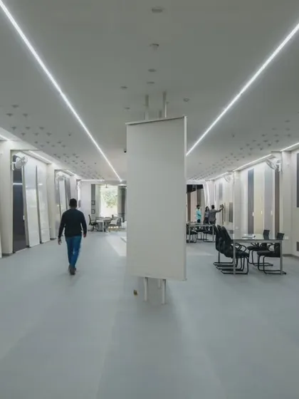 More images from the Krsimar marble showroom, detailing the sliding panel display system and the clean, spacious layout designed for an optimal client experience.