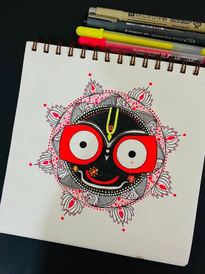 A hand-drawn mandala of Lord Jagannath, created for the Rath Yatra festival. The design is surrounded by lotus petals, symbolizing purity and divinity.