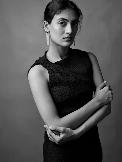 A three-quarter portrait showing a classic, strong pose. The focus on form and light gives this image a timeless, statuesque quality.