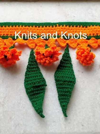 This 3 foot long Zendu toran with alternating orange flowers and green leaves is a popular choice for festive home decor. The length can be customized.
