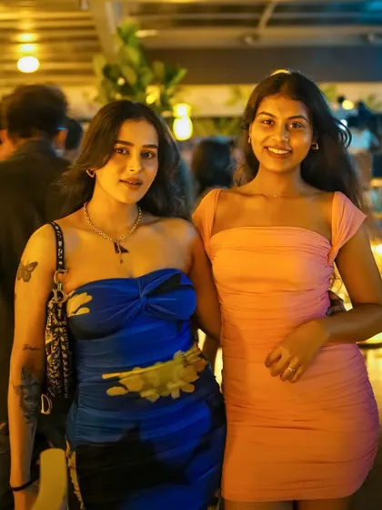 Two friends posing together, enjoying the great atmosphere.