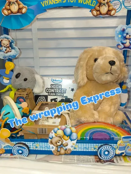 'Viyansh's Toy World' carriage, filled with soft toys and educational flash cards.
