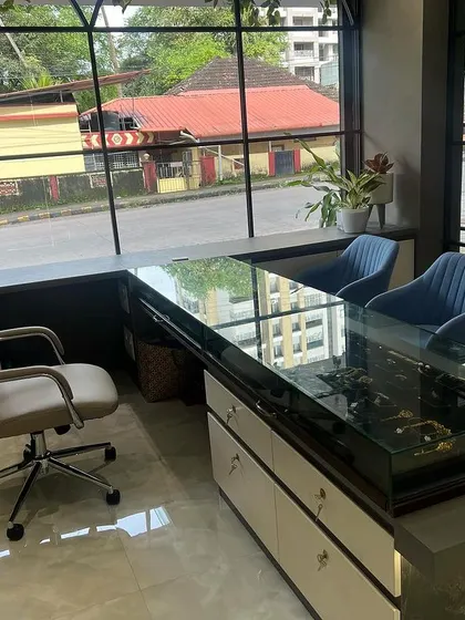 Our client consultation area is set against large windows, creating a bright and open atmosphere. It's the perfect spot to discuss your ideas for custom engraved necklaces or bridal jewellery.