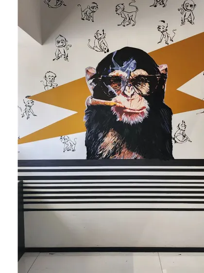 The 'Smokin Monkey' mural is another piece we created for the Centrix office to add a bit of fun and quirk. The design is a playful take on a classic cool character.
