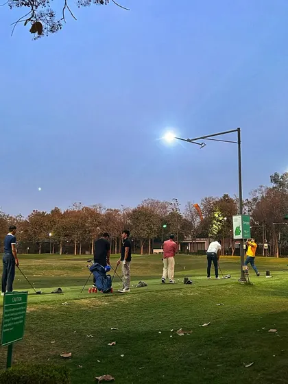 A shot of the range at twilight, with the moon visible in the sky.
