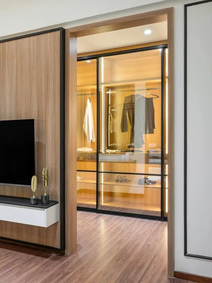 A duplicate of image 42, this view again shows the seamless integration of the walk-in closet into the bedroom design, highlighting our focus on creating functional and aesthetically pleasing spaces.