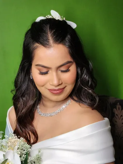 A close-up on this beautiful, warm-toned eye makeup. The soft smokey effect and matte lip create a look of sophisticated glamour.