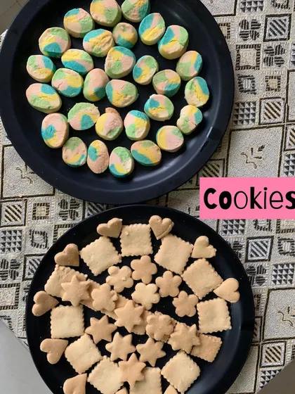 Colorful rainbow cookies and classic butter cookies in various shapes.