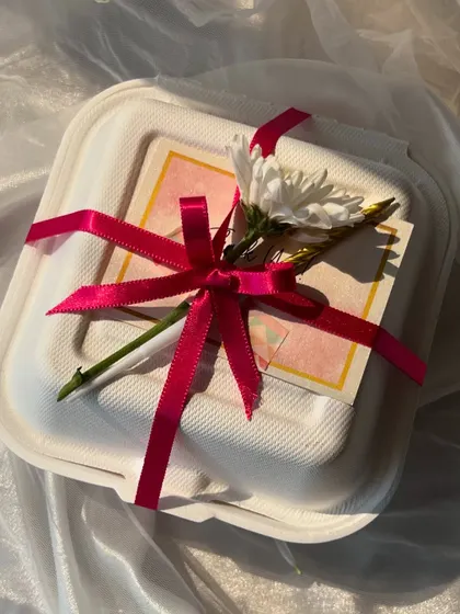 Various examples of my gift wrapping, showing different combinations of ribbons, flowers, and bags to suit any occasion.