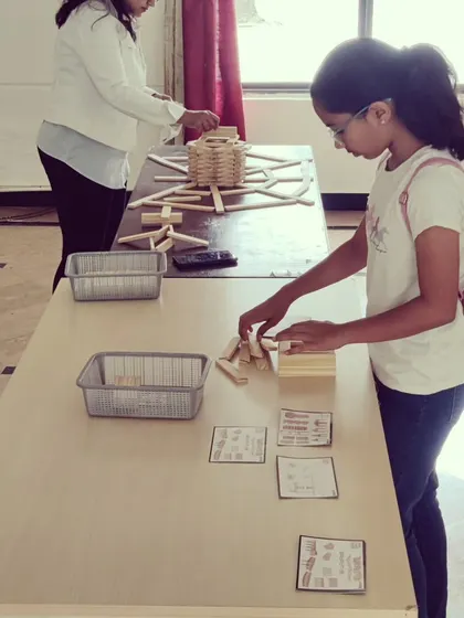 The focus in the room is always so real and inspiring. Each child gets their own set of planks and a space to bring their ideas to life, learning about balance and dedication through hands-on building.