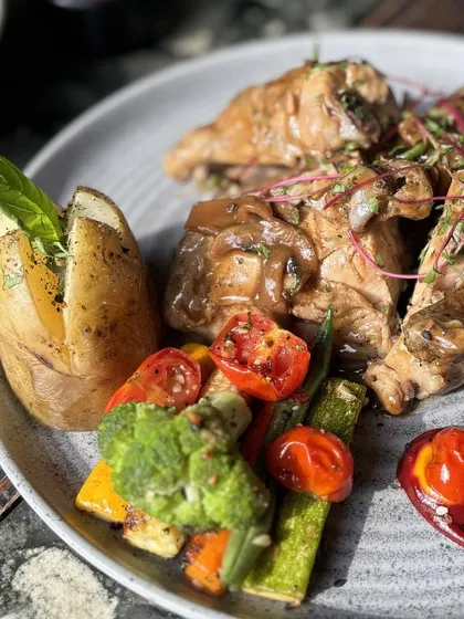 Another angle of our signature roast chicken, a dish that's both hearty and elegant.