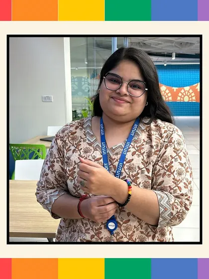 An employee at Intuit proudly wears the Ally Bracelet she made during our Pride Month workshop, a small but significant symbol of her support.