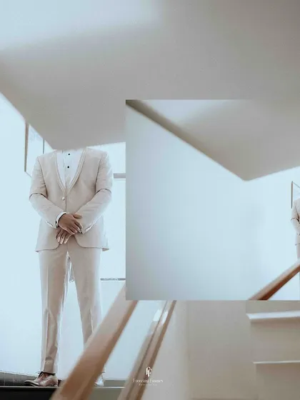 A minimalist and artistic collage of the groom in his light-colored suit, waiting on the stairs.