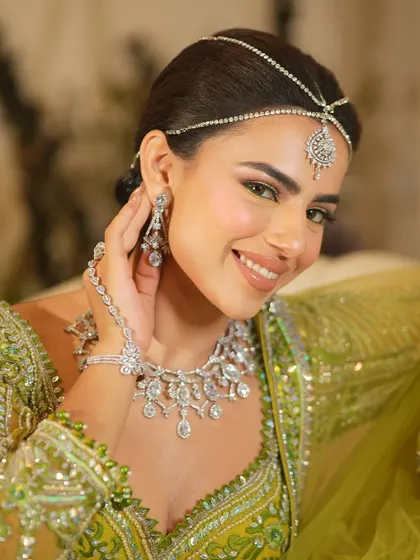 A happy and radiant Mehendi bride. The makeup is fresh and light, perfect for a day filled with fun and laughter.