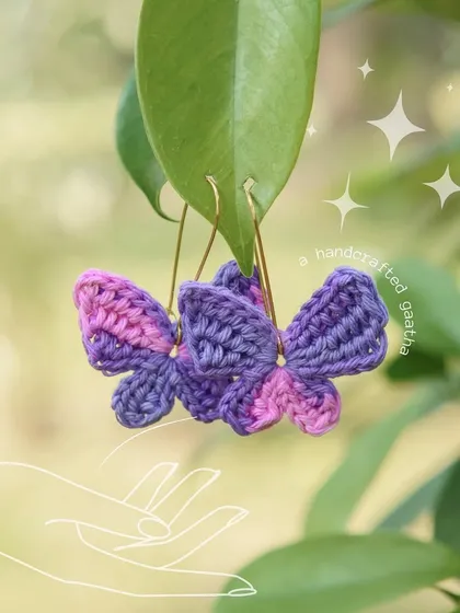Another beautiful shot of the pink and purple butterfly earrings, sparkling in the light.