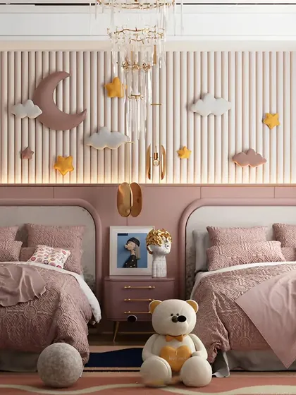 A dreamy shared bedroom in shades of dusty rose. The custom upholstered beds are complemented by whimsical cloud and star wall decor, creating a magical sky-themed sanctuary for two.