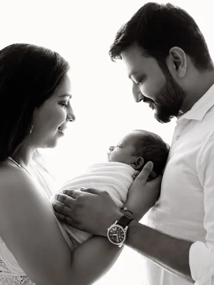 The same classic pose in black and white, which adds a timeless and artistic quality to the family portrait.