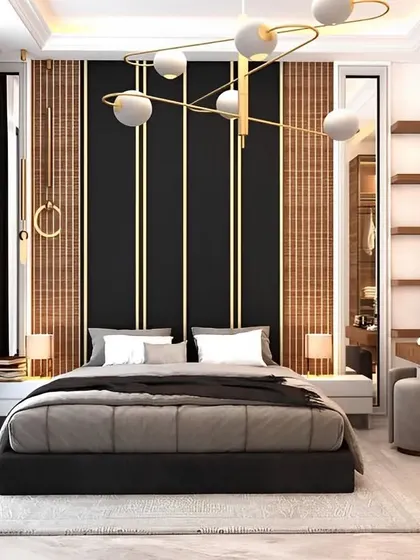 A modern bedroom design with a striking black and wood-paneled accent wall featuring gold trim. The room includes a built-in vanity table, combining bold style with practical functionality.