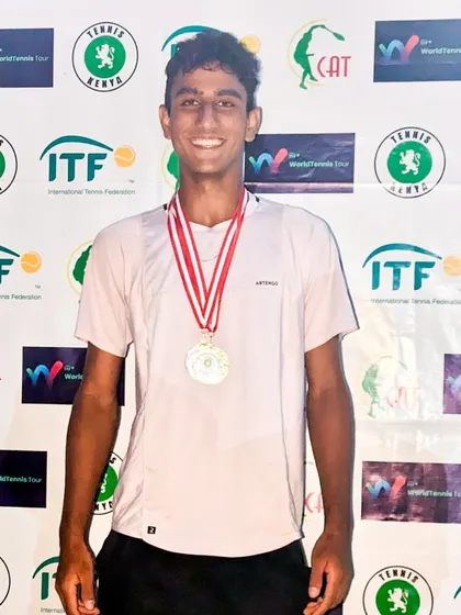 Celebrating a double crown win at the Junior ITF J60 tournament in Nairobi, Kenya.