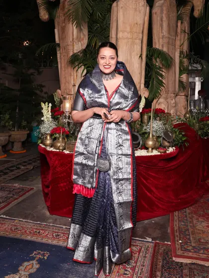 The full effect of the Rajput-inspired saree drape. The way the silver stole is worn adds structure and a sense of ceremony to the look.