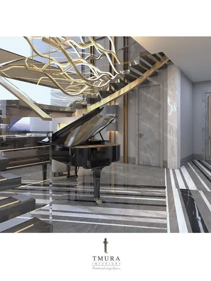 We believe in creating wholesome experiences. A grand piano is positioned here not just as an instrument, but as a sculptural element under a custom-designed, wave-like light fixture that cascades down the modern staircase.