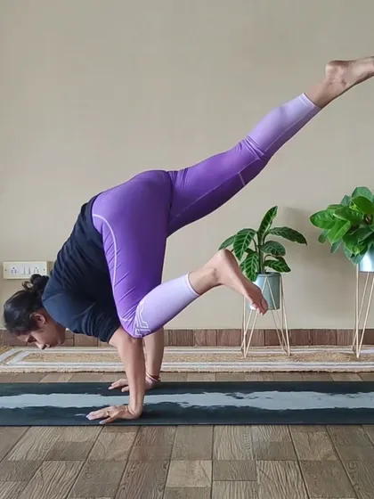 The One-Legged Crow Pose is an advanced arm balance that challenges your strength and focus. This student demonstrates incredible control and stability, showcasing the results of dedicated practice.