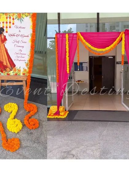 A bright and welcoming entrance for a half-saree ceremony. I used pink drapes and marigold garlands for the doorway and set up a personalized welcome sign.